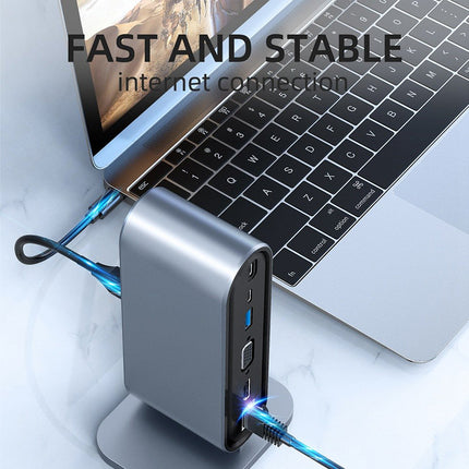 Laptop with a USB hub device on a light gray background, emphasizing fast and stable internet connection.