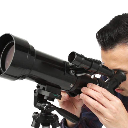 Person using a telescope on a white background