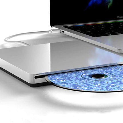 Laptop with a CD/DVD drive open, showing a blue compact disc.