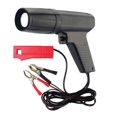 Black handheld device with red clips and black cables on a white background