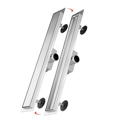 Two metallic shower drain covers with a white background