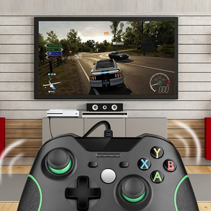Gaming setup with TV displaying a racing game and controller in foreground