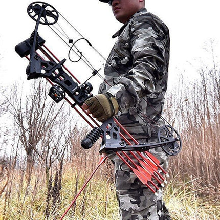 Person holding a compound bow in a camouflage outfit in an outdoor setting