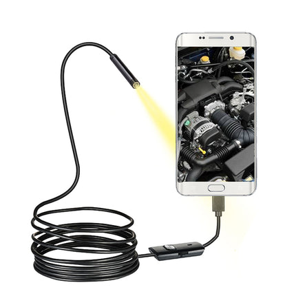 Smartphone with a USB endoscope attached, displaying an engine inspection app on the screen.