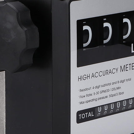 Close-up of a high accuracy liter meter with a black dial display, silver metal body, and white label showing specifications.