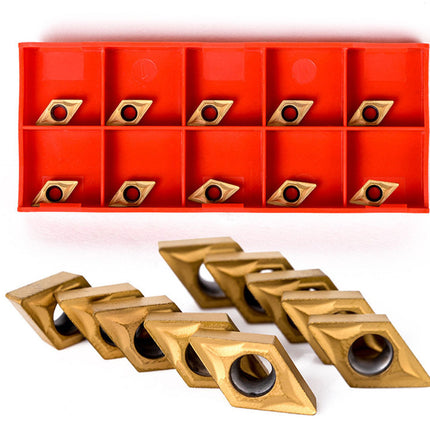 Set of gold metal cutting tools in front of a red tool holder with multiple slots.
