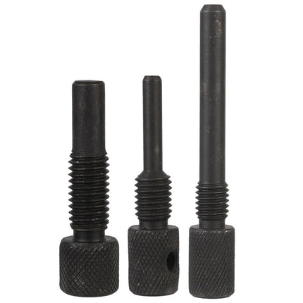 Three black threaded metal pins on a white background