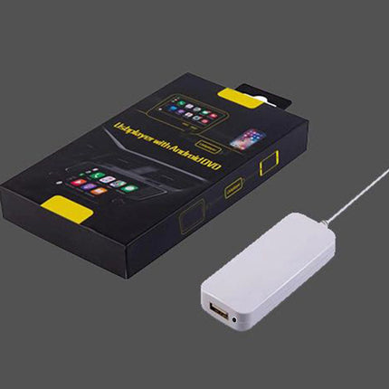 A white USB hub adapter with a single USB-A port, shown next to its black retail packaging box with yellow accents on a solid dark gray background.