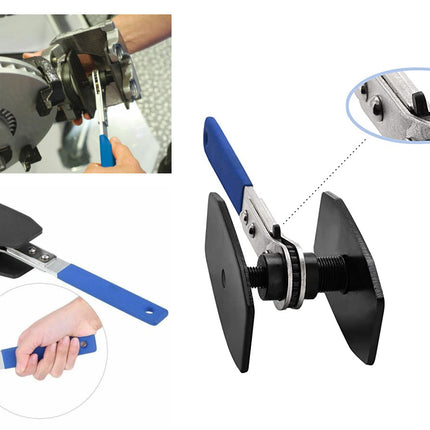 Mechanical tool with blue handle and black paddle, used for gear maintenance.