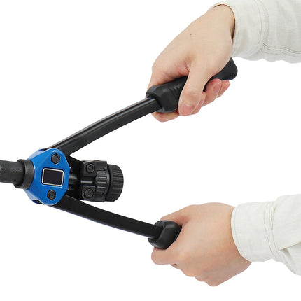 Hand holding a black and blue tool against a white background