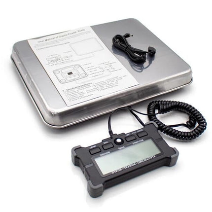 Digital scale with a display and cable on a white background