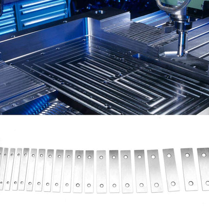 CNC machine with metal cutting tool and a set of metal blades on a white background