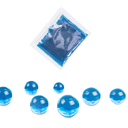Blue gel packs and beads on a white background