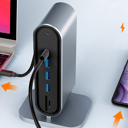 USB hub connected to a laptop and smartphone on a light gray background