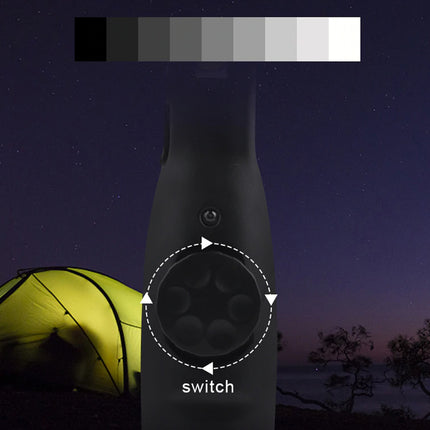 Black device labeled 'switch' with a glowing yellow tent in the background under a starry night sky.