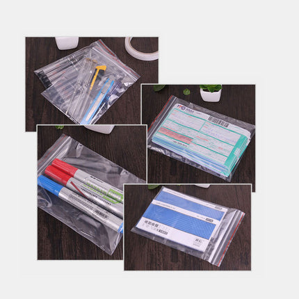 Collage of clear plastic bags containing stationery items on a wooden surface.