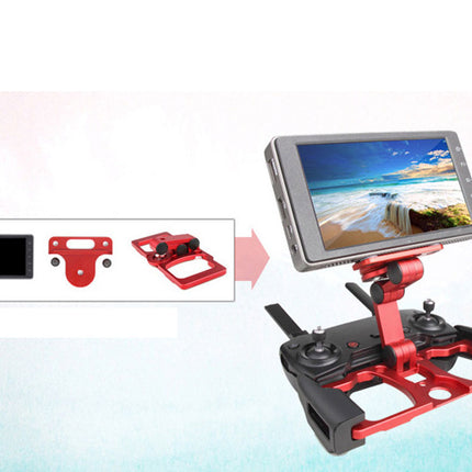 Red and black drone remote control with an attached screen display showing a beach scene, alongside inset views of a screen and red mounting hardware on a pale blue background.