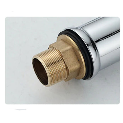 Close-up of a brass plumbing fitting on a white background