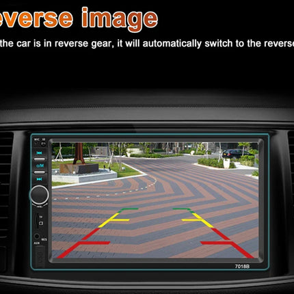 A car infotainment screen showing a reverse camera view with red, yellow, and green guide lines, set against a black dashboard-like background with text at the top reading 'Reverse image' and a descriptive caption.