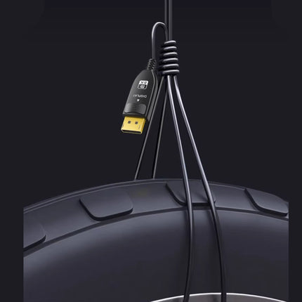 USB cable with a car tire in the background