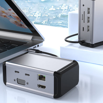 Laptop connected to a USB hub with a scenic background