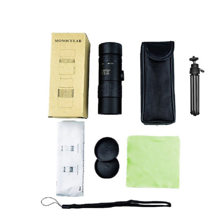 Monocular with accessories including a box, cleaning cloth, and tripod on a white background