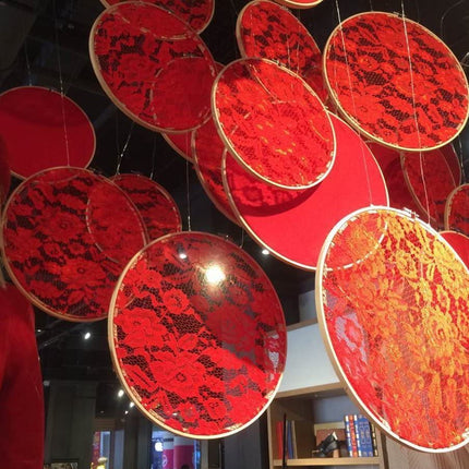 Red circular decorations hanging from the ceiling