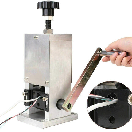 Metallic tool with a hand holding a metal rod, inset showing close-up of the tool's mechanism.