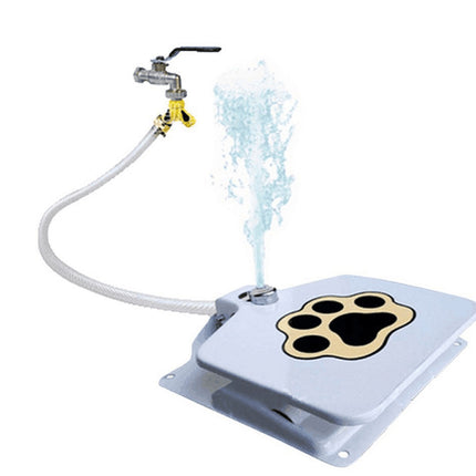 A pet fountain water fountain with a white lid featuring a gold and black paw print, connected to a white hose and a metal faucet with a water spray demonstration, on a white background.