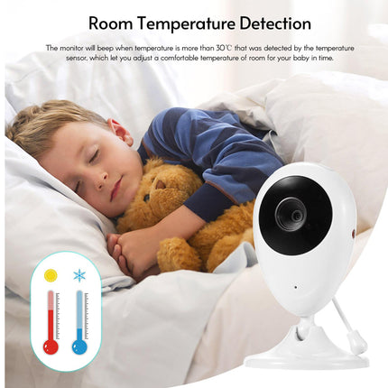 Child sleeping with a teddy bear next to a temperature monitoring device