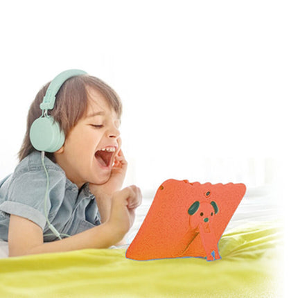 Child wearing headphones and using a tablet with a colorful case on a white background