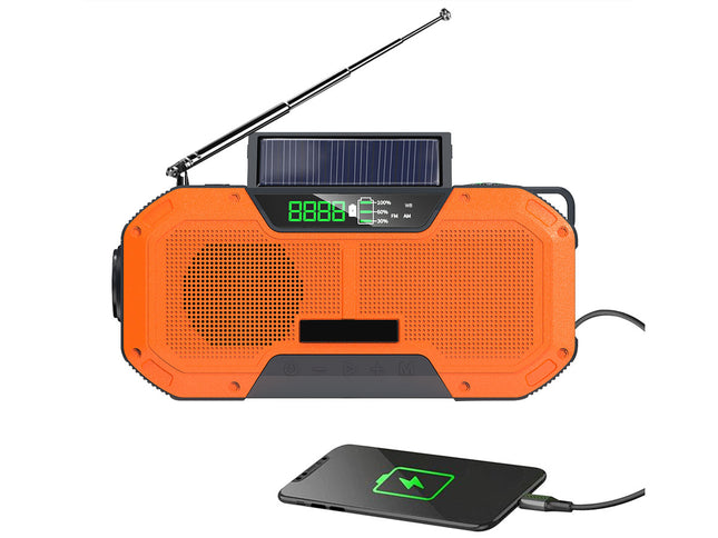 Orange solar-powered radio with USB charging pad on a white background