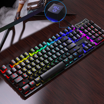 Gaming keyboard with RGB lighting on a desk, showing a close-up of the key labeled 'SL'.