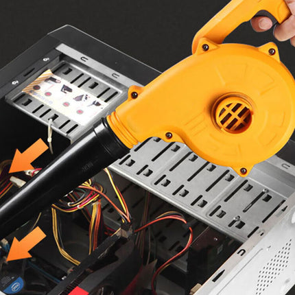 Person using a yellow and black blower to clean inside a computer case.