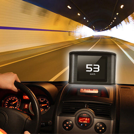 A car dashboard display showing 53 km/h in a tunnel, with a driver's hand on the steering wheel and the interior of the vehicle visible.