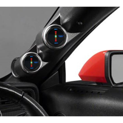 Car interior with two circular gauges on the dashboard.