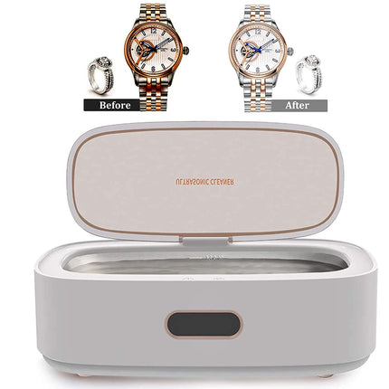 A white and rose gold watch cleaning and sterilization box shown open, with a before-and-after comparison of a watch and ring above it. The inside lid features the brand name 'IV LAYDONIC CTEMBER'.