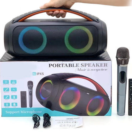 Portable speaker with colorful lights, microphone, and remote control on a white background