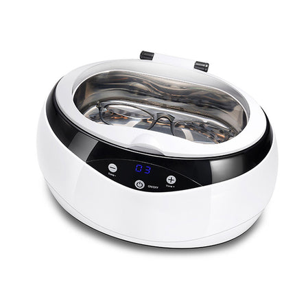 White ultrasonic cleaner with digital display on a white background