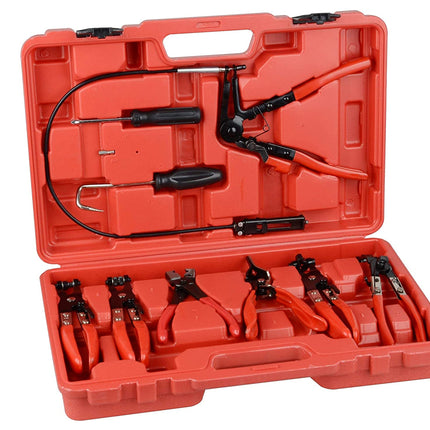 An open red plastic tool case containing multiple hand tools with red and black handles, photographed on a plain white background.