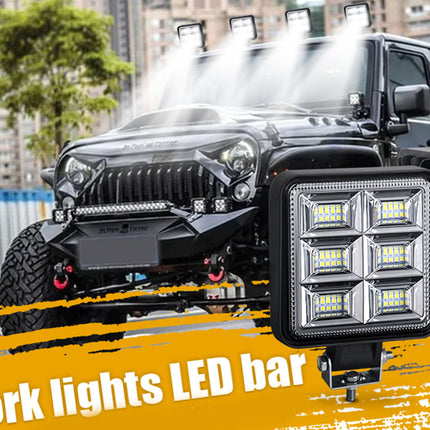 LED work light bar on a vehicle with a cityscape background